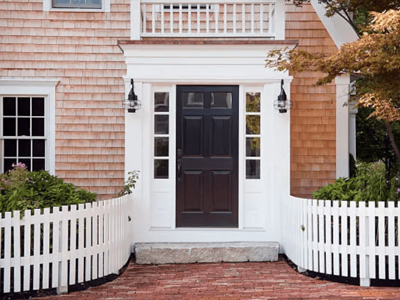 Coastal entry door painting - teal front door with white trim