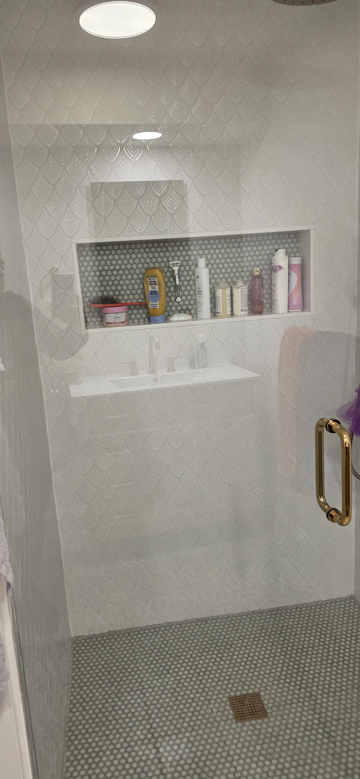Sparkling clawfoot bathtub and glass enclosure