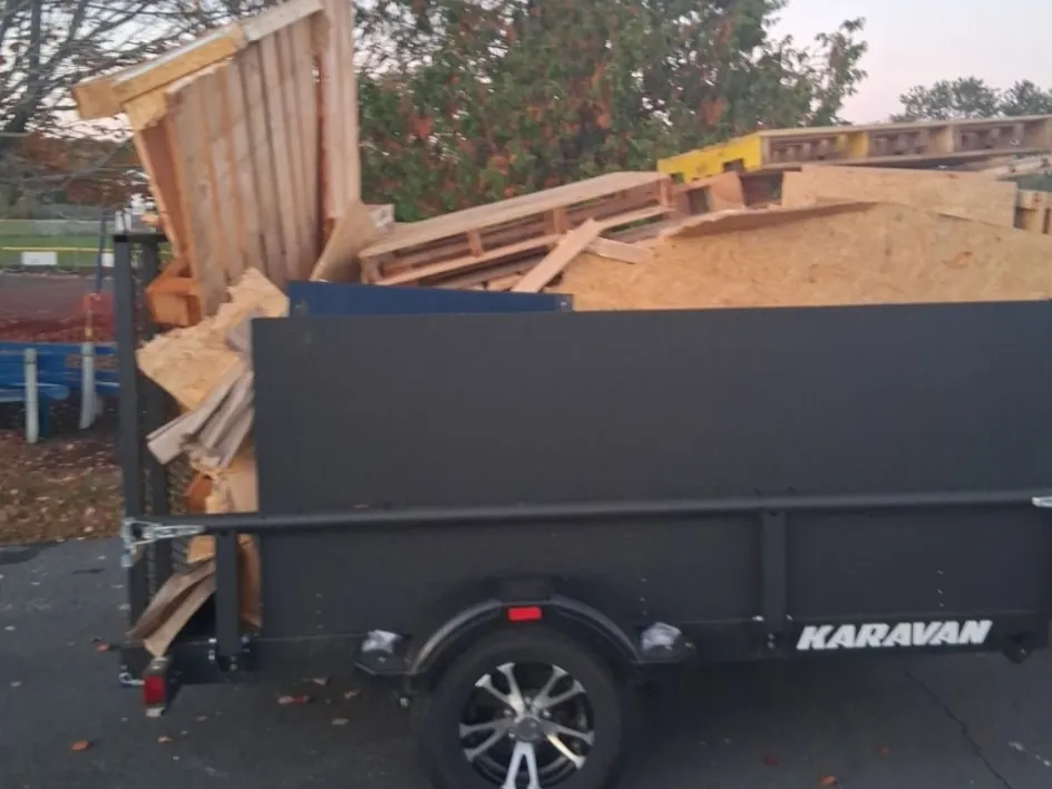 Trailer loaded with wood and construction debris, hauled away