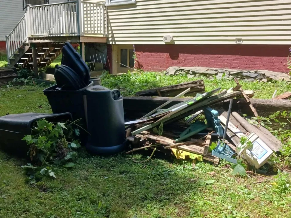 Yard and deck debris removed from a backyard